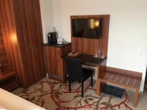 Postel nebo postele na pokoji v ubytování Wellnesshotel Schönblick
