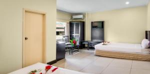 Postel nebo postele na pokoji v ubytování Tanoa Skylodge Hotel