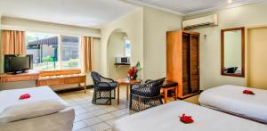 Postel nebo postele na pokoji v ubytování Tanoa Skylodge Hotel