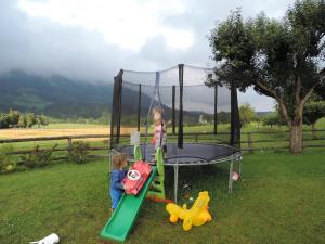 two young children playing on a trampoline at Nagerhof in Gnesau