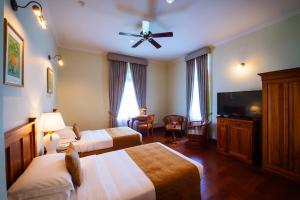 Voodi või voodid majutusasutuse Galle Face Hotel toas