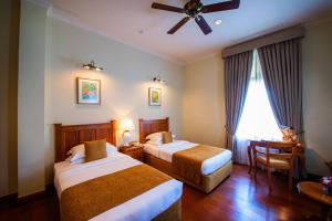 Voodi või voodid majutusasutuse Galle Face Hotel toas