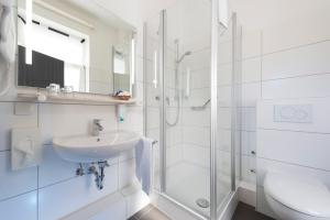Ein Badezimmer in der Unterkunft Atlantic Hotel Garni