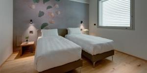 Voodi või voodid majutusasutuse Hotel The Cube toas