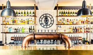 a bar with lots of bottles of alcohol at Avon Gorge by Hotel du Vin in Bristol