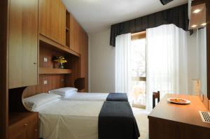 A bed or beds in a room at Hotel Vina De Mar