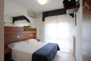 A bed or beds in a room at Hotel Vina De Mar