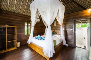 Voodi või voodid majutusasutuse Laguna Reef Huts toas