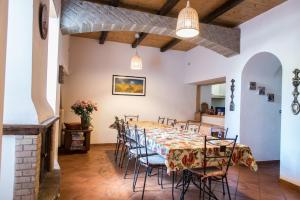 a large dining room with a table and chairs at Olive Tree Hill in Zagarolo