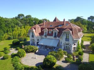 an aerial view of a house with a roof at Château du Clair de Lune - Boutique Luxury Hotel in Biarritz