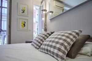Łóżko lub łóżka w pokoju w obiekcie LEEWAYS LOFT in FUENCARRAL