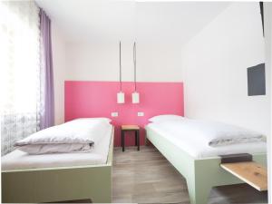 Postel nebo postele na pokoji v ubytování Residence Vis à Vis