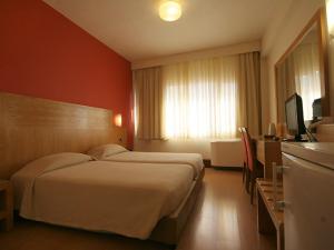 Postel nebo postele na pokoji v ubytování Diana Hotel