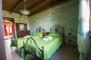 Tempat tidur dalam kamar di Casa Vacanza il Mandorlo