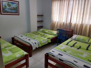 Postel nebo postele na pokoji v ubytování Hotel Real Pólux