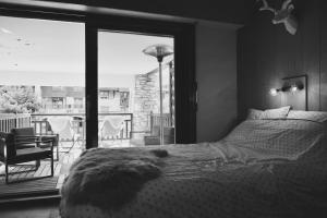 Rúm í herbergi á Little Suite Val d'Isère