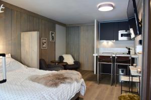 Rúm í herbergi á Little Suite Val d'Isère