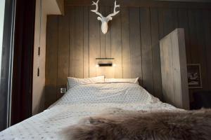 Rúm í herbergi á Little Suite Val d'Isère
