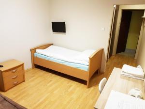 Posteľ alebo postele v izbe v ubytovaní Apartamenty i Pokoje przy Parku