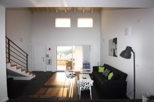 a living room with a couch and a table at Holiday Home Anna in Klek