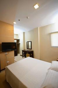 Postel nebo postele na pokoji v ubytování Hotel Formosa Daet