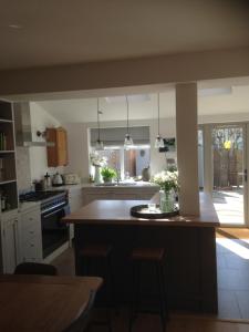 a kitchen with a large island in the middle at NUMBER 19 Chichester B&B in Chichester