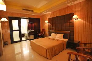 Säng eller sängar i ett rum på Hua Jia Motel