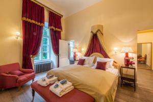 a bedroom with a large bed with towels on it at Kernu Manor Hotel & SPA in Kernu