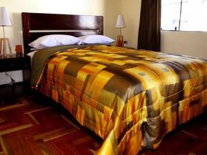 Ένα ή περισσότερα κρεβάτια σε δωμάτιο στο Hostal Samichay
