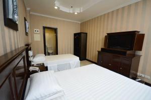 Postel nebo postele na pokoji v ubytování Hotel Formosa Daet