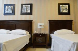 Postel nebo postele na pokoji v ubytování Hotel Formosa Daet