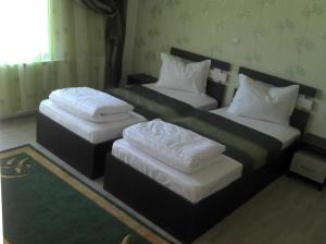Postel nebo postele na pokoji v ubytování Best Hotel