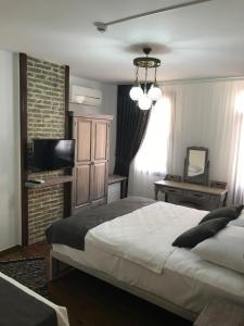 Postel nebo postele na pokoji v ubytování Ayshe Hotel