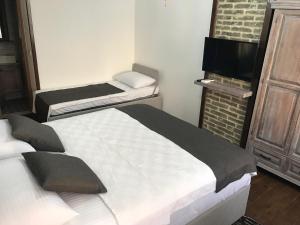 Postel nebo postele na pokoji v ubytování Ayshe Hotel