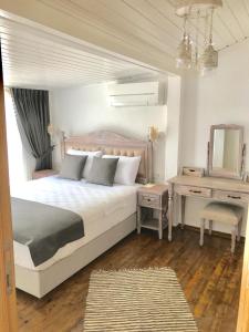 Postel nebo postele na pokoji v ubytování Ayshe Hotel