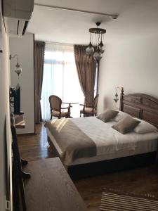 Postel nebo postele na pokoji v ubytování Ayshe Hotel