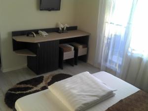 Postel nebo postele na pokoji v ubytování Best Hotel