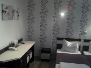 Postel nebo postele na pokoji v ubytování Best Hotel