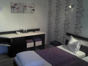 Postel nebo postele na pokoji v ubytování Best Hotel