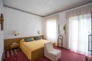 Postel nebo postele na pokoji v ubytování Hotel Lido