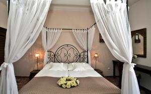 Postel nebo postele na pokoji v ubytování Hotel Tacl