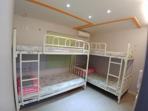 Postel nebo postele na pokoji v ubytování Bomgoro Guesthouse