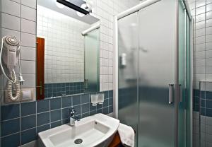 Koupelna v ubytování Hotel Tacl