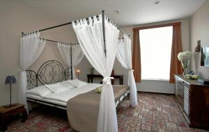 Postel nebo postele na pokoji v ubytování Hotel Tacl