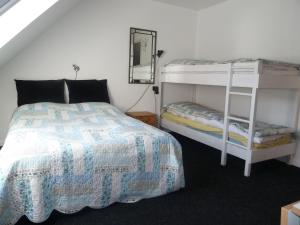 Lliteres en una habitació de Give Bed & Breakfast