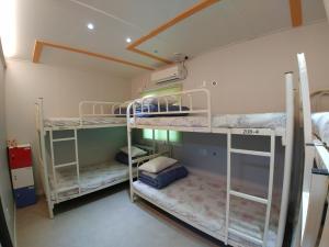 Postel nebo postele na pokoji v ubytování Bomgoro Guesthouse