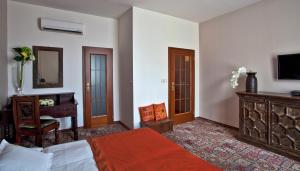 Postel nebo postele na pokoji v ubytování Hotel Tacl