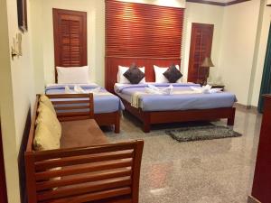 Кровать или кровати в номере Busyarin Hotel