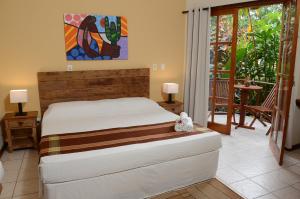 Cama ou camas em um quarto em Pousada Moryba