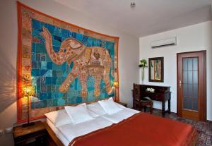 Postel nebo postele na pokoji v ubytování Hotel Tacl